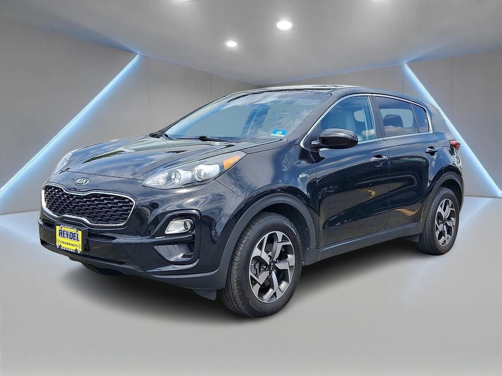 2021 Kia Sportage LX in Black Cherry Pearl — front three-quarter view